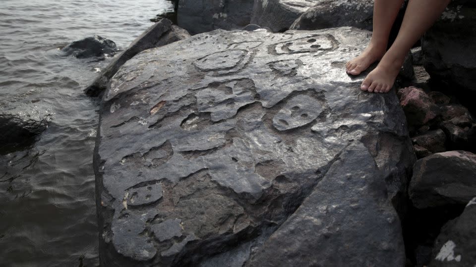 The ancient stone carvings were exposed when the Amazon's water level dropped during a drought in Manaus, Amazonas state. - Suamy Beydoun/Reuters