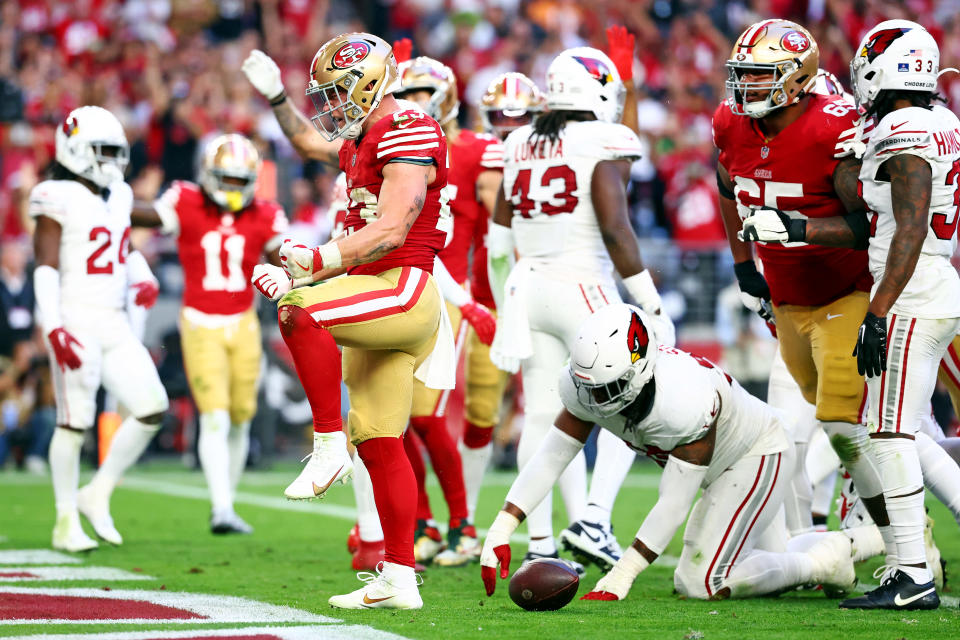 Dec 17, 2023; Glendale, Arizona, USA; San Francisco 49ers running back Christian McCaffrey (23) celebrates after running for a touchdown during the third quarter against the Arizona Cardinals at State Farm Stadium. Mandatory Credit: Mark J. Rebilas-USA TODAY Sports