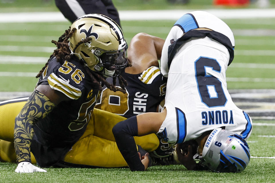 Carolina Panthers quarterback Bryce Young is sacked by New Orleans Saints linebacker Demario Davis during the second half of an NFL football game in New Orleans, Sunday, Dec. 10, 2023. (AP Photo/Butch Dill)