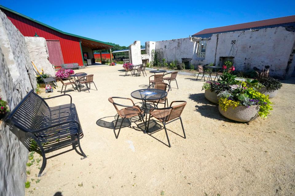 One of the patios is within the old stone and mortar walls of a barn that’s been torn down at the Old Germantown restaurant on Pleasant View Drive in Germantown.