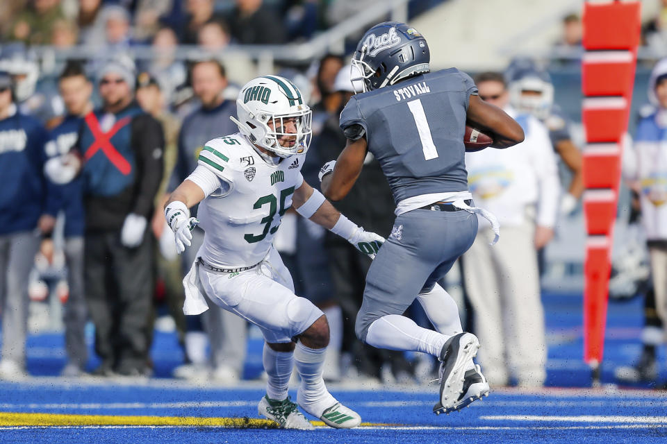 Ohio linebacker Dylan Conner (35) attempts to tackle Nevada wide receiver Melquan Stovall (1) in the first half of the Famous Idaho Potato Bowl NCAA college football game Friday, Jan. 3, 2020, in Boise, Idaho. (AP Photo/Steve Conner)