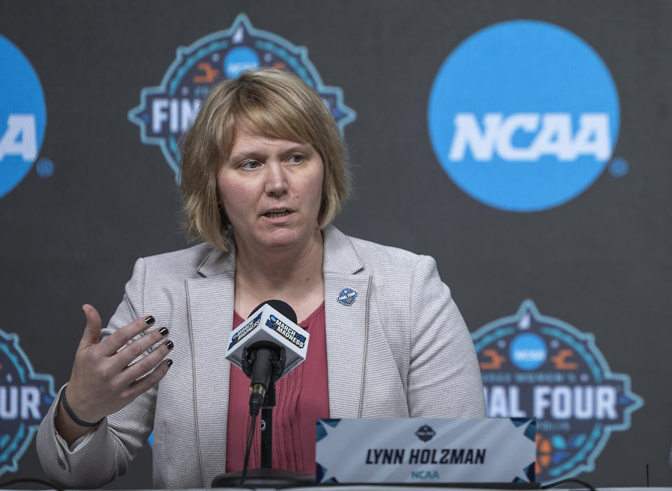 FILE - Lynn Holzman, NCAA vice president for women's basketball, speaks during a news conference Wednesday, March 30, 2022, in Minneapolis. The NCAA changed the format of the women's tournament this year, featuring two regional sites instead of the traditional four. The games in Greenville, South Carolina and Seattle are the latest step to grow the sport and show the ladies can stand on their own. (Elizabeth Flores/Star Tribune via AP, File)