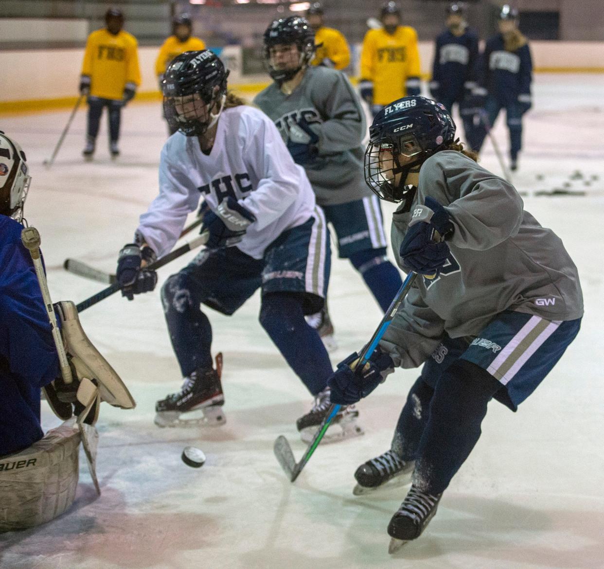 Framingham High School Girls Hockey junior Mackenzie "Mac" Coleman takes a shot at practice at Loring Arena, Jan. 20, 2023.