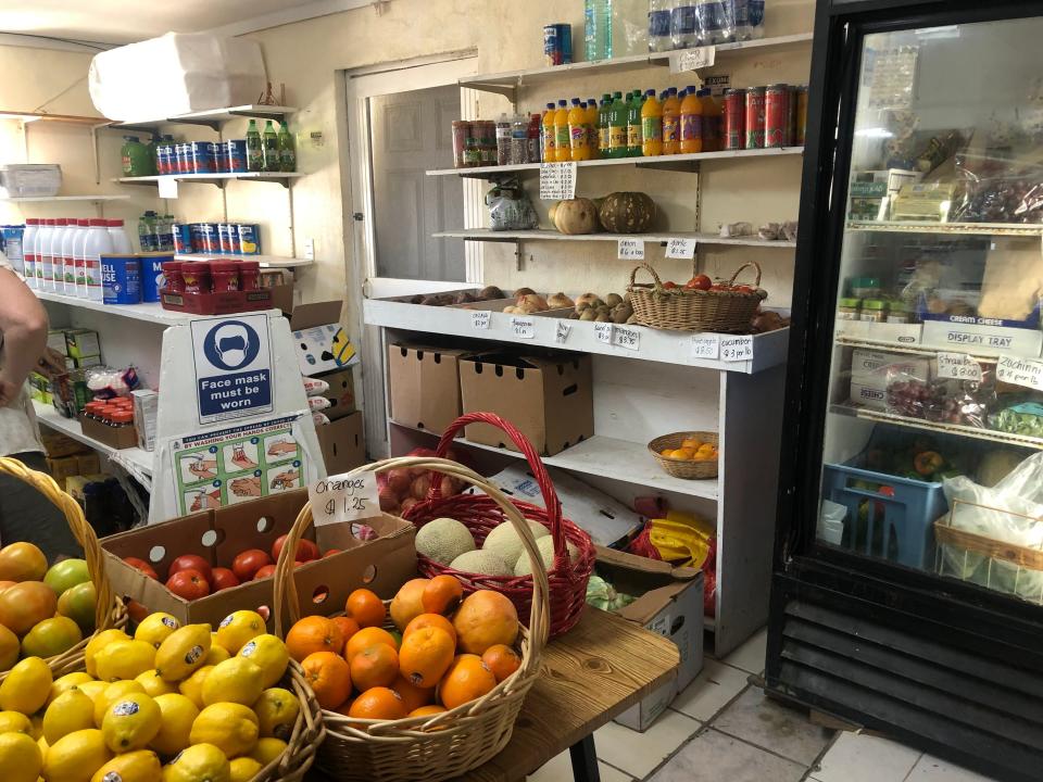 Small grocery store in Bahamas with produce and refrigerated section