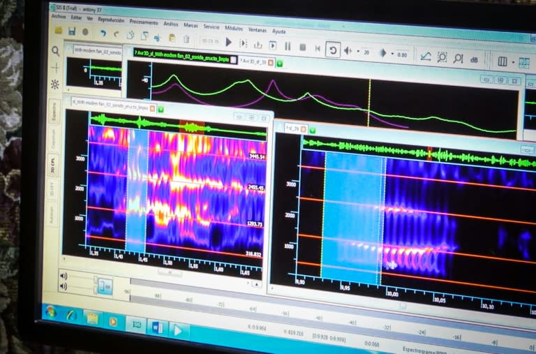 TV grab taken from a recent recording by Cuban Television showing environmentalists analyzing sounds in areas where officials from the US embassy in Havana were allegedly affected by mysterious attacks in the past months