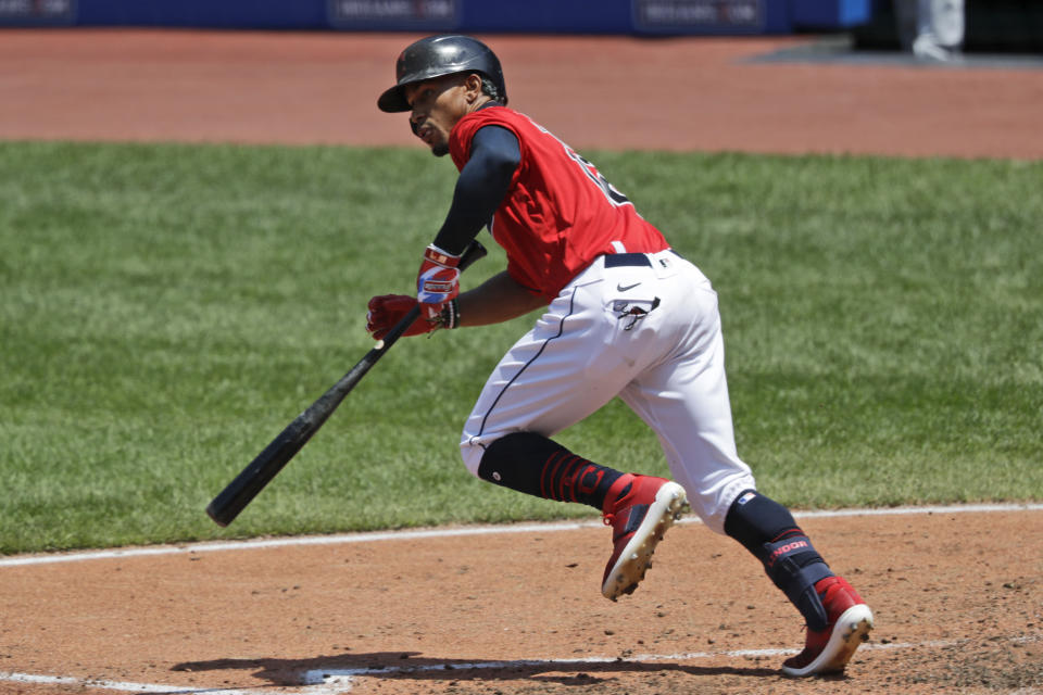 Cleveland Indians' Francisco Lindor watches his ball after hitting a one run double in the third inning in a baseball game against the Kansas City Royals, Sunday, July 26, 2020, in Cleveland. (AP Photo/Tony Dejak)