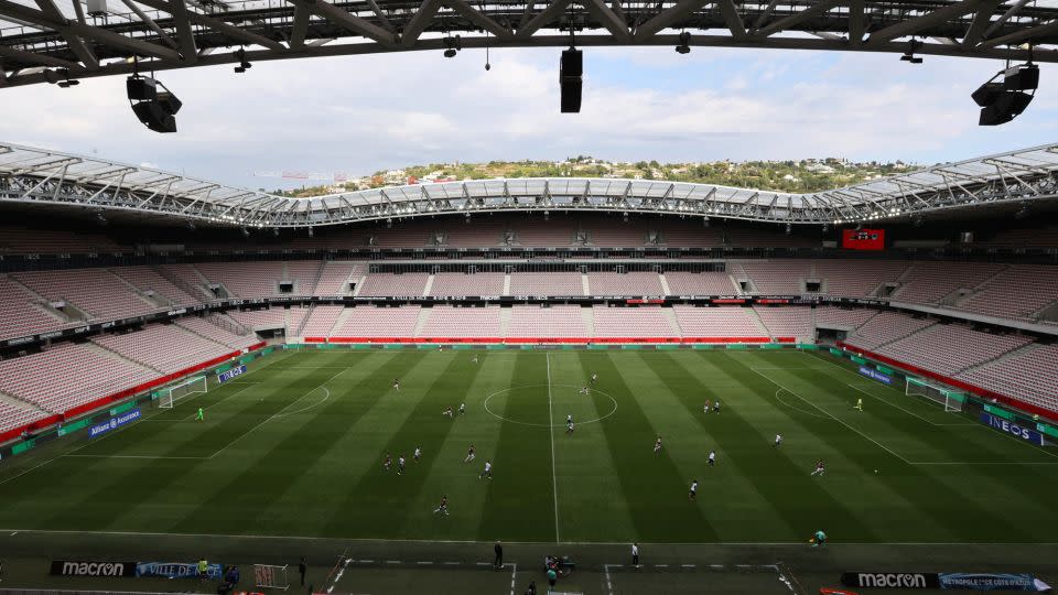 A photograph shows a general view of players competing without supporters during the French L1 "Huis clos" football match between O.G.C Nice and F.C des Girondins de Bordeaux at "Allianz Riviera" stadium in Nice, southeastern France, on August 28, 2021. - Valery Hache/AFP/Getty Images