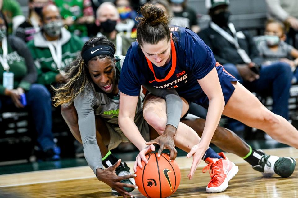 Michigan State's Tamara Farquhar, left, and Illinois' Sara Anastasieska battle for the ball during the third quarter on Thursday, Dec. 9, 2021, at the Breslin Center in East Lansing.