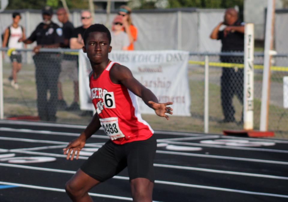 Jackson's Dashawn Bruist (2493) gets ready to receive a baton exchange during the boys 4x400-meter relay  at the Bob Hayes Invitational Track Meet on March 19, 2022. [Clayton Freeman/Florida Times-Union]