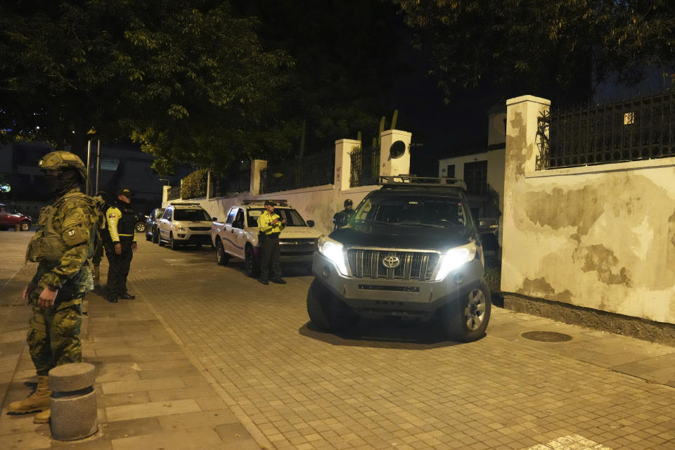 A vehicle drives in reverse into the Mexican embassy in Quito, Ecuador, Friday, April 5, 2024. Ecuadorian police officers forcibly broke into the embassy where former Ecuadorian Vice President Jorge Glas was holed up, just hours after the Mexican government had granted him political asylum. (AP Photo/Dolores Ochoa)