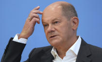 German Chancellor Olaf Scholz addresses the media during his first annual summer news conference in Berlin, Germany, Thursday, Aug. 11, 2022. (AP Photo/Michael Sohn)