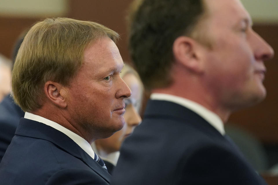 Jon Gruden listens in court Wednesday, May 25, 2022, in Las Vegas. A Nevada judge heard a bid Wednesday by the National Football League to dismiss former Las Vegas Raiders coach Jon Gruden's lawsuit accusing the league of a "malicious and orchestrated campaign" including the leaking of offensive emails ahead of his resignation last October. (AP Photo/John Locher)