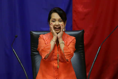 Philippine's Former President and Congresswoman Gloria Macapagal Arroyo gestures after she was elected by congressmen as the new Speaker of the House of Representatives in Quezon city, Metro Manila, in Philippines July 23, 2018. REUTERS/Czar Danceld