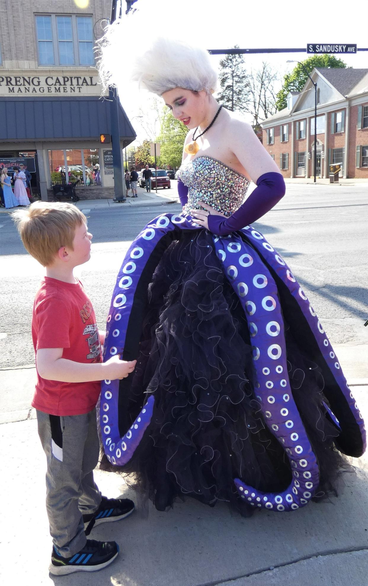 Raven Sharrock, dressed as “The Little Mermaid” villain Ursula, greets a fan during the Bucyrus Area Chamber of Commerce’s May First Friday event in 2023. First Friday 2024 begins this week.