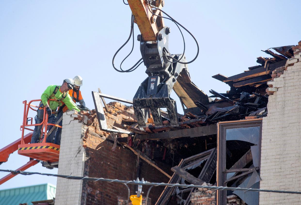 Workers from Louisville-based Eslich Wrecking Co. began tearing down the former Tiger Rags building and adjacent structure on Wednesday afternoon. The building teardown is expected to continue into next week.