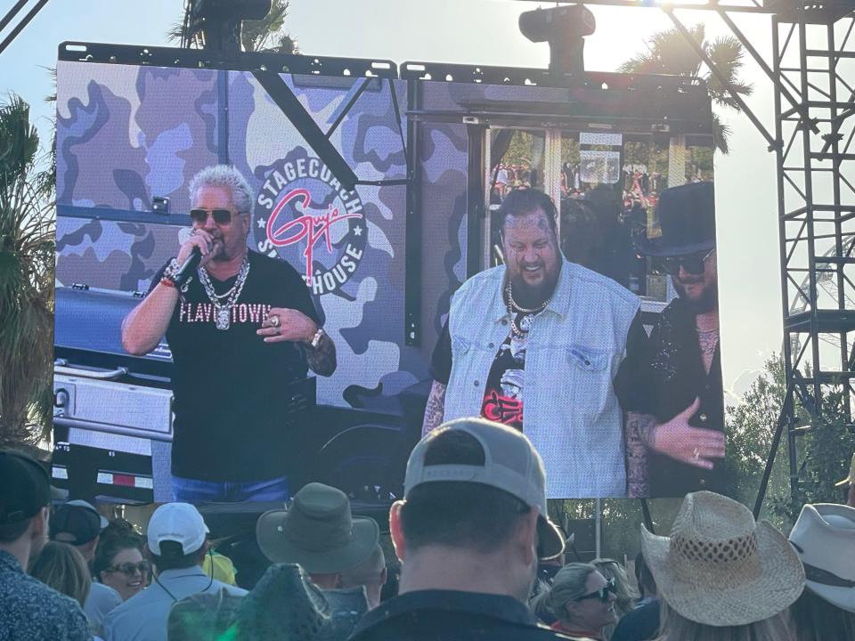 Guy Fieri, left, was joined by performers Jelly Roll and Paul Cauthen for a Smokehouse Cooking Demo on Friday.