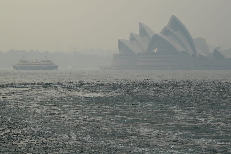 The Sydney Opera House can be seen as smoke haze from bushfires in New South Wales blankets the CBD in Sydney