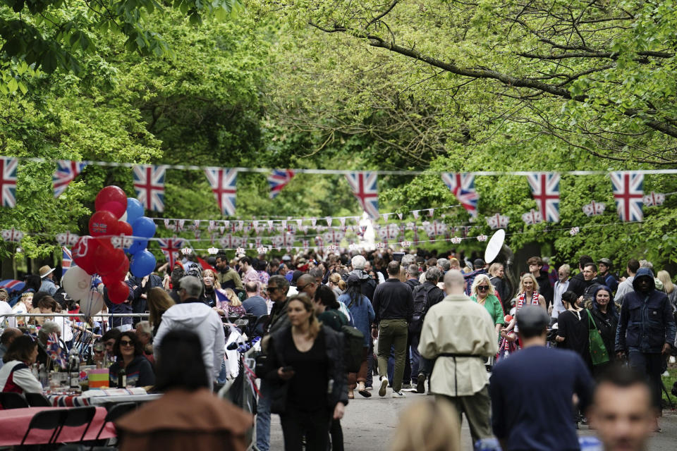People take part in a Coronation Big Lunch in Regent's Park, London, Sunday May 7, 2023. Thousands of people across the country are celebrating the Coronation Big Lunch to mark the crowning of King Charles III and Queen Camilla. (Jordan Pettitt/PA via AP)
