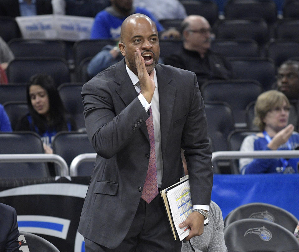 FILE - In this Dec. 5, 2018, file photo, Denver Nuggets assistant coach Wes Unseld Jr. calls out instructions during the second half of an NBA basketball game against the Orlando Magic, in Orlando, Fla. The Wizards are set to formally introduce Wes Unseld Jr. as their new coach Monday, July 19, 2021, after hiring him to replace Scott Brooks. (AP Photo/Phelan M. Ebenhack, File)