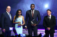 Usain Bolt of Jamaica (2nd R) and lmaz Ayana of Ethiopia (2nd L) pose with their awards and Prince Albert II of Monaco (L) and IAAF's President Sebastian Coe, after being elected male and female World Athlete of the Year 2016 in Monaco, December 2, 2016. REUTERS/Eric Gaillard