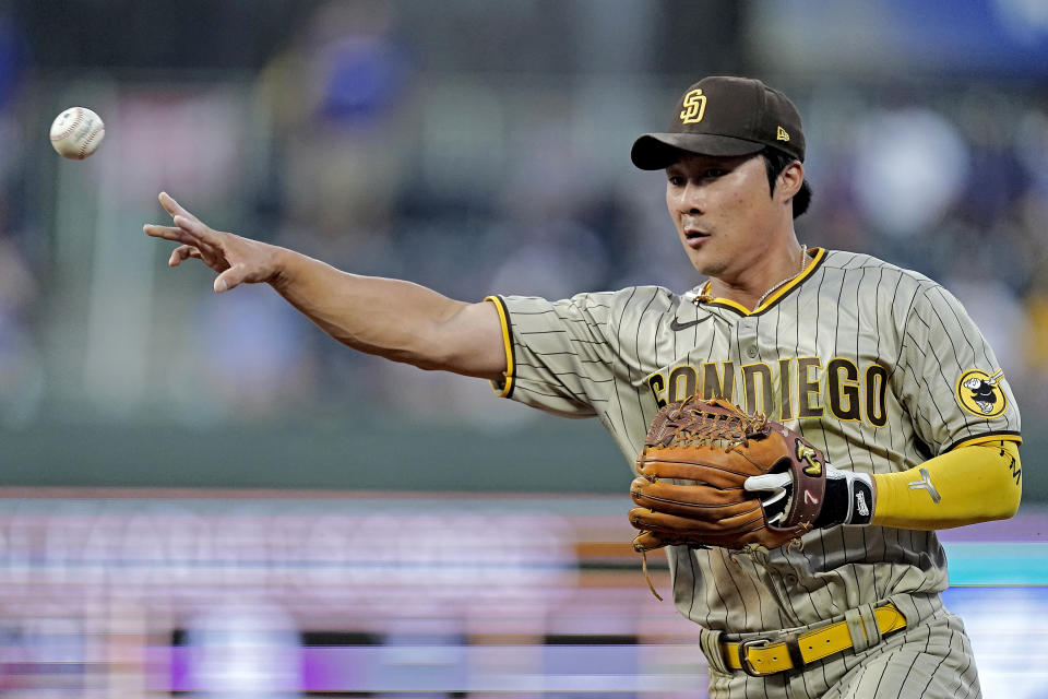 San Diego Padres shortstop Ha-Seong Kim throws to first for the out on Kansas City Royals' Drew Waters during the fourth inning of a baseball game Saturday, Aug. 27, 2022, in Kansas City, Mo. (AP Photo/Charlie Riedel)