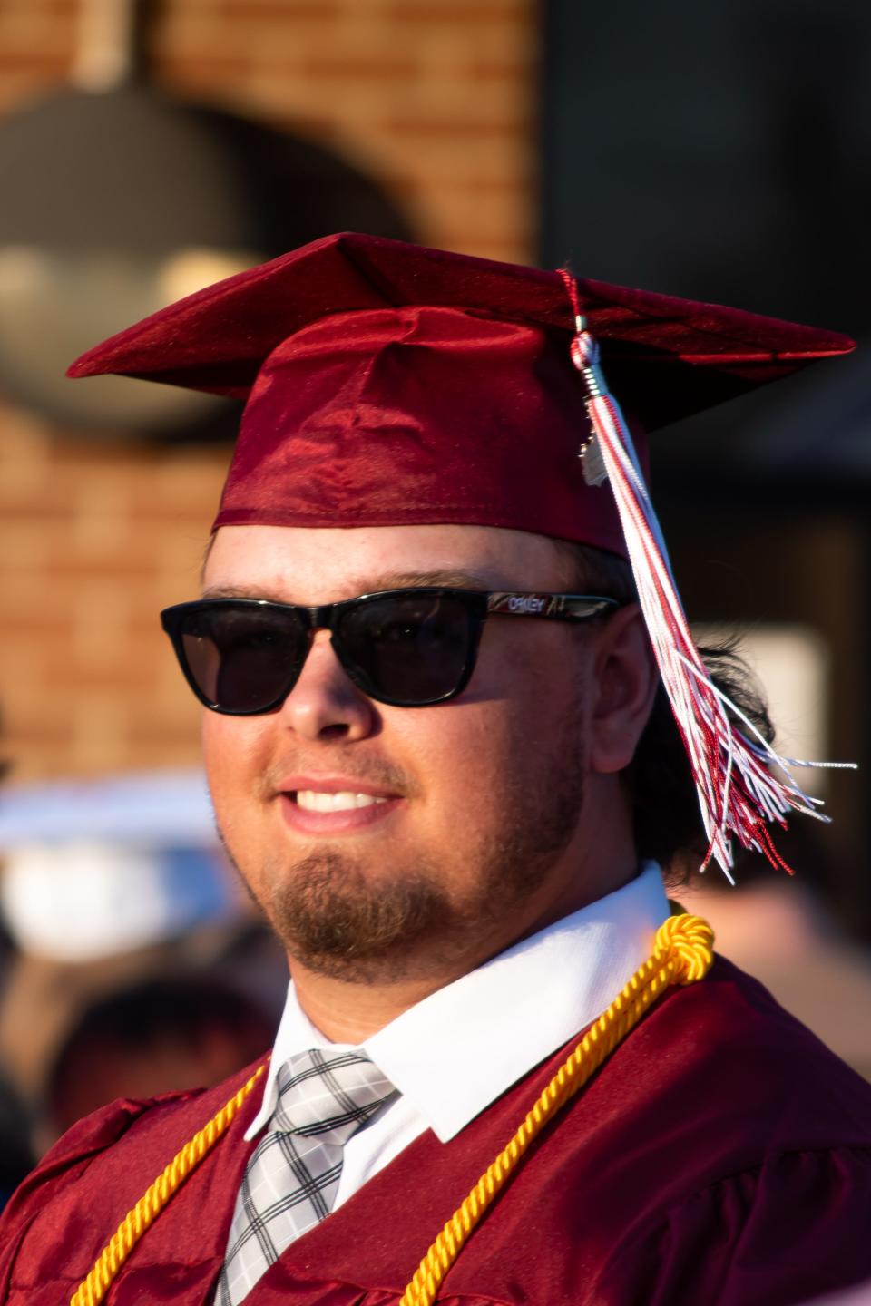 A new John Glenn graduate dons his shades, ready to take on the world after the 113th annual commencement ceremony at the high school. For more photos visit www.daily-jeff.com.