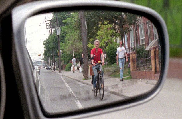 Adjusting side mirrors correctly like this can give drivers the best view of passing cyclists. Picture: Getty