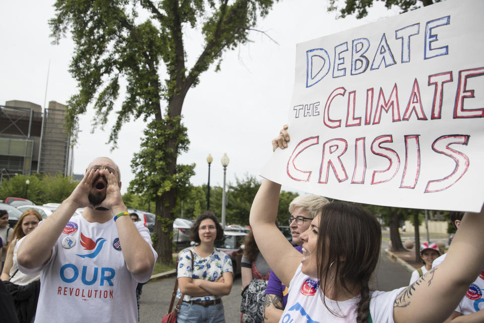 Protests calling on the DNC to host a climate debate last summer.&nbsp; (Photo: Sarah Silbiger via Getty Images)