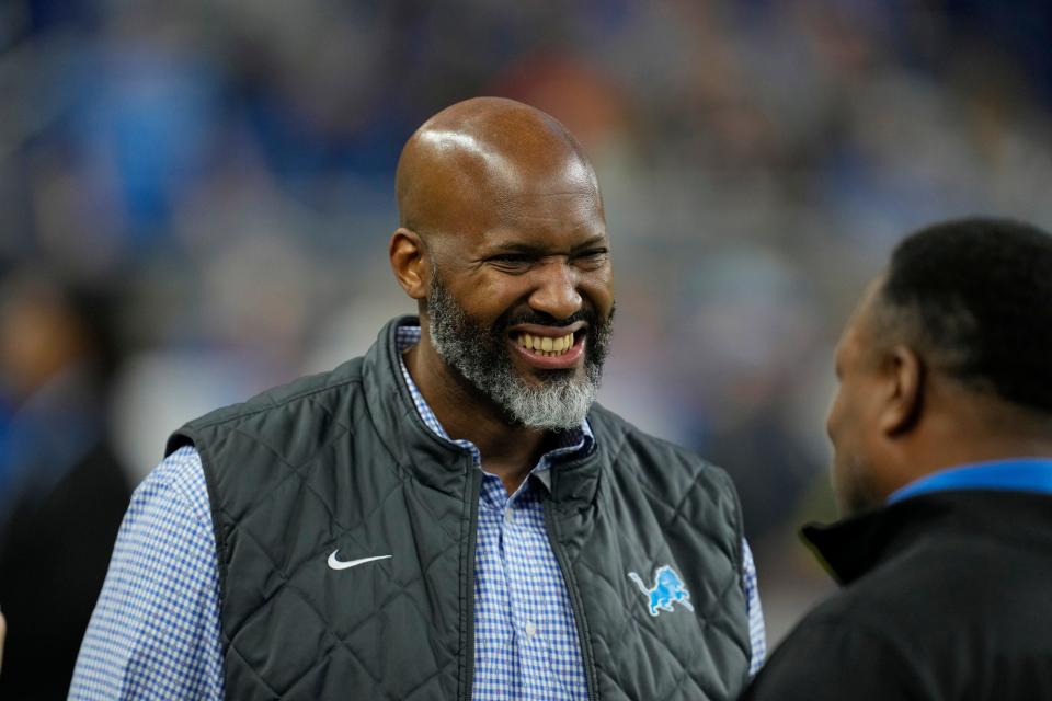 Lions general manager Brad Holmes talks with Barry Sanders before the game against the Bears, Sunday, Jan. 1, 2023, at Ford Field in Detroit.