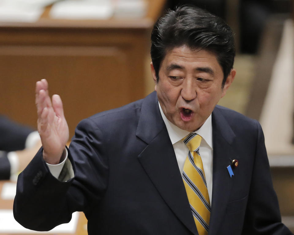 Japan's main opposition Liberal Democratic Party President Shinzo Abe speaks at Japanese Prime Minister Yoshiko Noda during a debate at Parliament in Tokyo Wednesday, Nov. 14, 2012. During the heated parliamentary exchange with Abe, Noda said that he is ready to dissolve the parliament by Friday, bringing an election within weeks, if Japan's main opposition party agrees to key electoral reforms. (AP Photo/Itsuo Inouye)