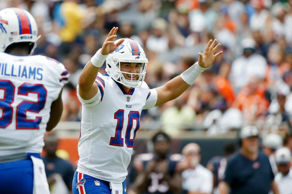 Buffalo Bills quarterback Mitchell Trubisky (10) smiles after a touchdown  against the Chicago Bears during the first half at Soldier Field.