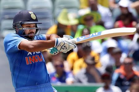 India's Rohit Sharma hits a boundary during their One Day International cricket match against Australia in Perth January 12, 2016. REUTERS/Bill Hatto