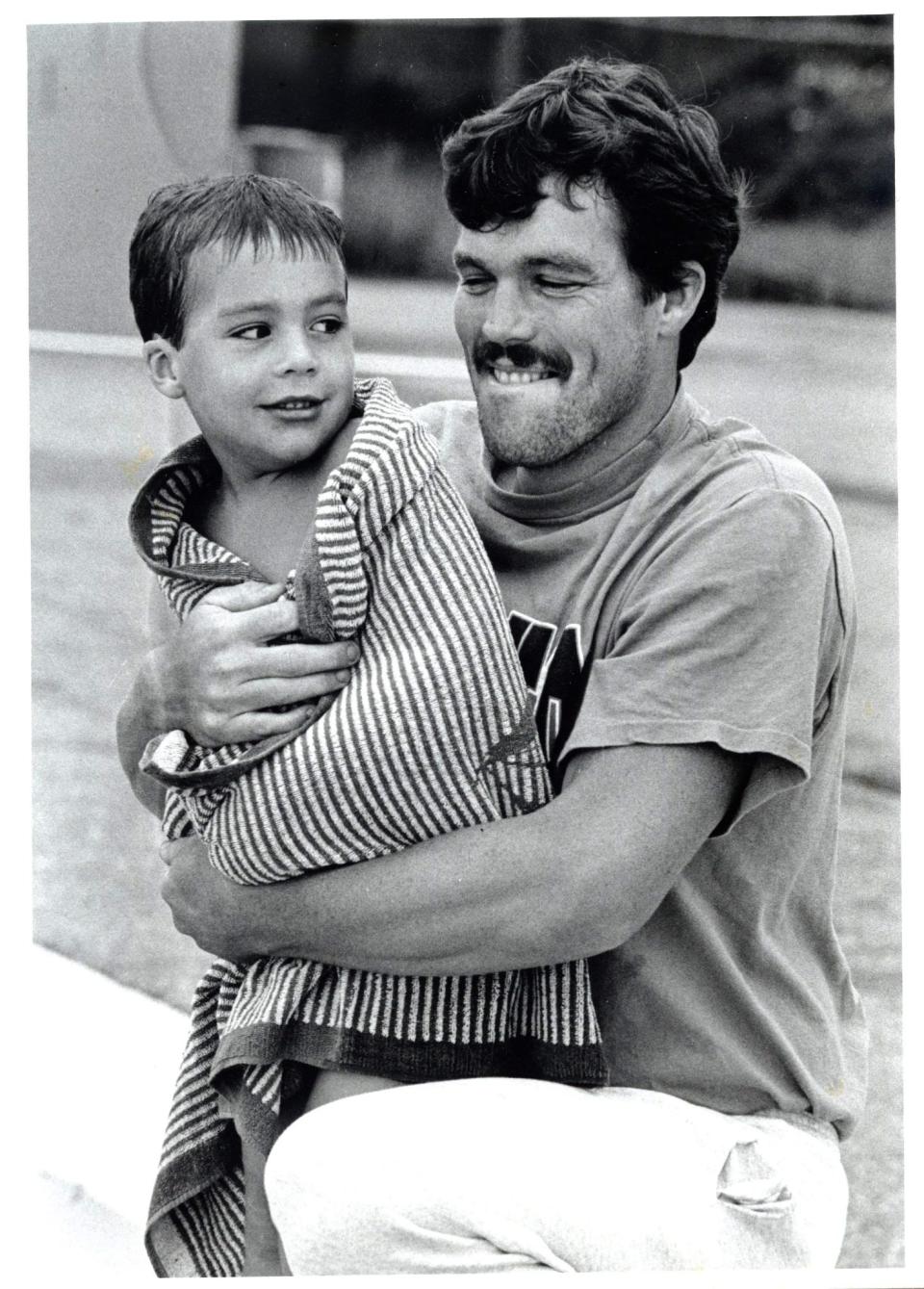 An August 1992 photo from the Portsmouth Athenaeum's Portsmouth Press Collection shows Mark Allinson wrapping his son, Andrew, in a towel at the Peirce Island Pool.