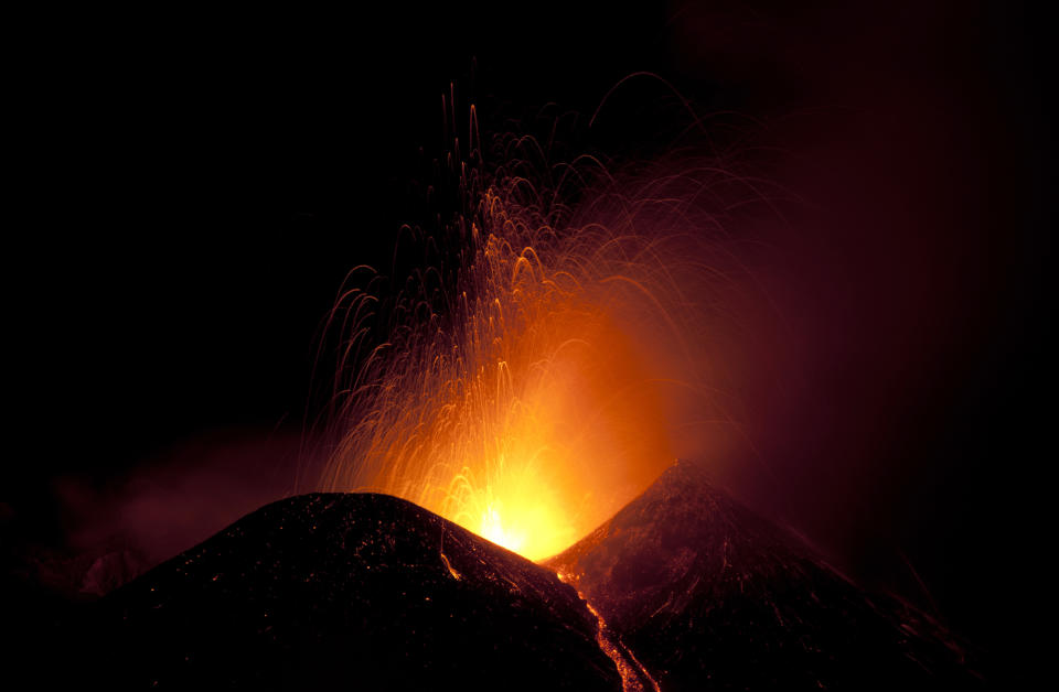 Italy's volcanic Mount Etna spews lava during an eruption on the southern Italian island of Sicily April 11, 2013. Mount Etna is Europe's tallest and most active volcano. Picture taken April 11, 2013. REUTERS/Antonio Parrinello (ITALY - Tags: ENVIRONMENT SOCIETY)