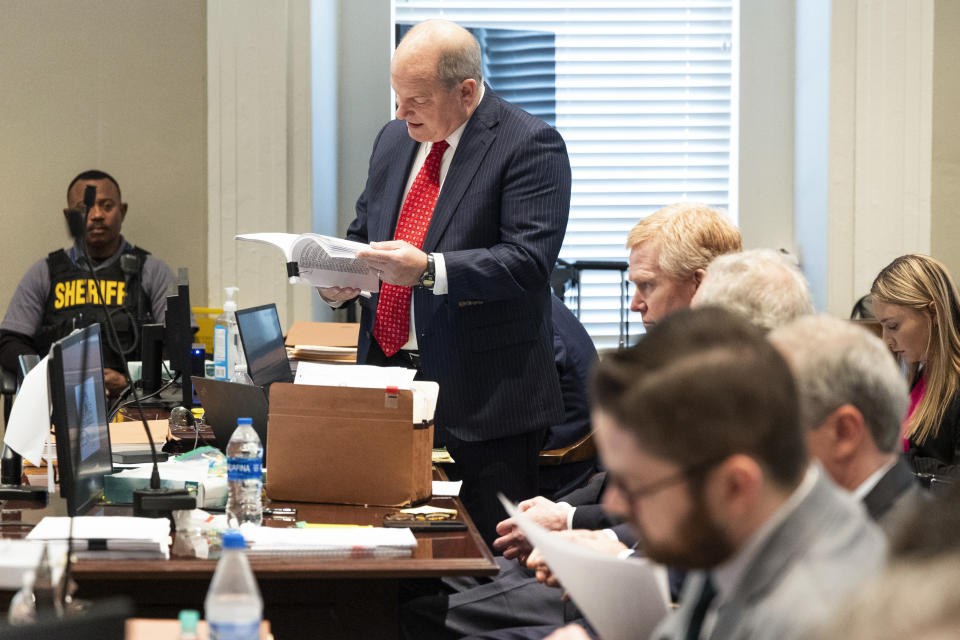 Defense attorney Jim Griffin reviews evidence during his double murder trial at the Colleton County Courthouse on Tuesday, Feb. 7, 2023, in Walterboro, S.C. The 54-year-old attorney is standing trial on two counts of murder in the shootings of his wife and son at their Colleton County home and hunting lodge on June 7, 2021. (Joshua Boucher/The State via AP, Pool)