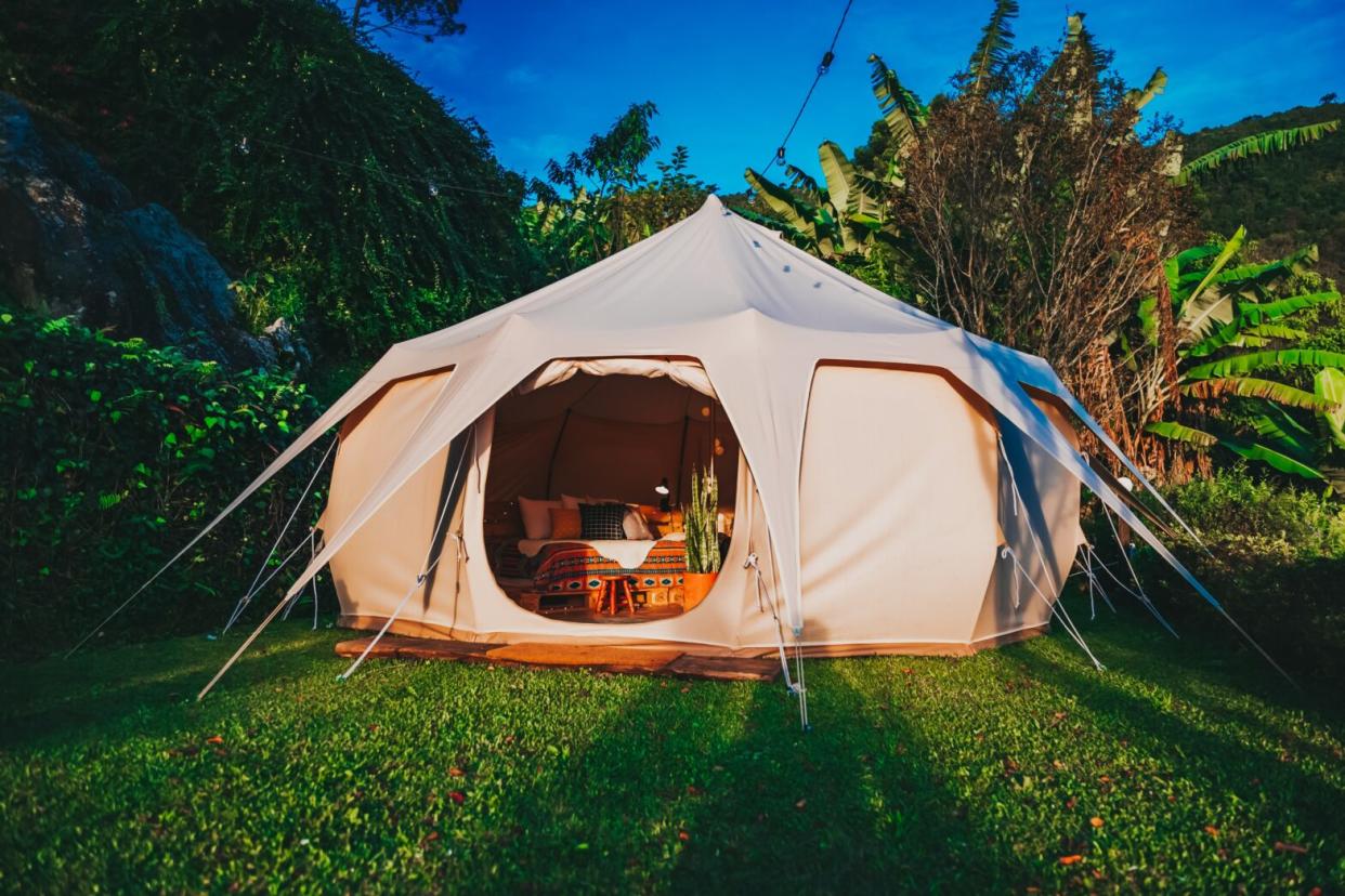 Glamping camp tent outdoors during sunset - camping hacks