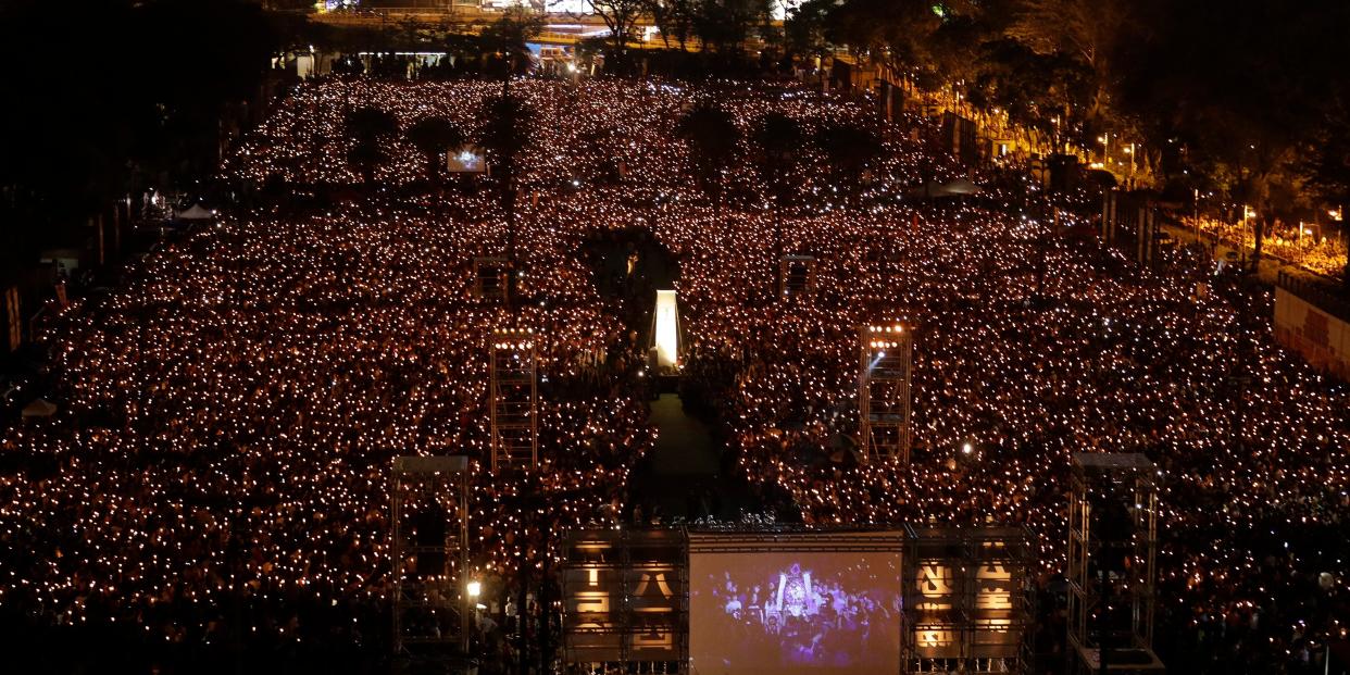 Thousands attend a candlelight vigil  at Victoria Park in Hong Kong for victims of the Chinese government's brutal 1989 crackdown in Tiananmen Square, on Tuesday, June 4, 2019.