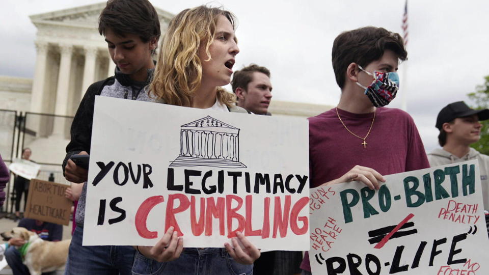 Protests outside the Supreme Court following the leak of a draft opinion that would overturn the 1973 decision in Row v. Wade, and open up abortion to be made illegal in states across the country.  / Credit: AP/Mariam Zuhaib