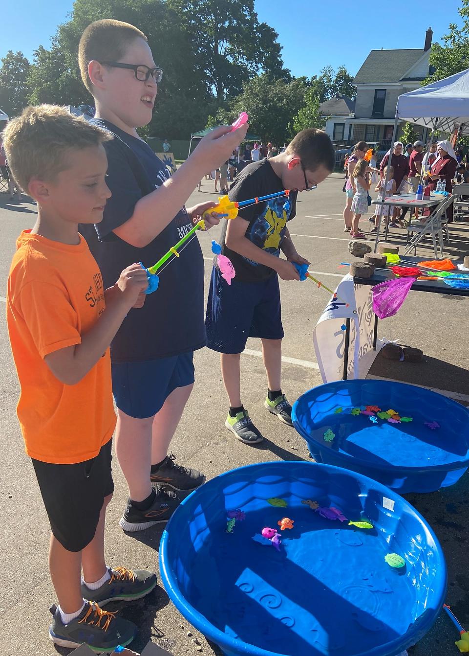 Coy Yunker and Thomas and Frank Drumm took part in a fishing game at Sturgis Fest "Family Night."