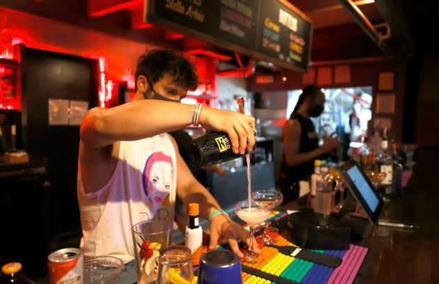 A bartender makes cocktails at Oasis in San Francisco on July 29. The San Francisco Bar Owner Alliance is encouraging members to require bar customers to show proof of vaccination or a negative COVID-19 test within 72 hours of a bar visit. (Photo: Justin Sullivan via Getty Images)