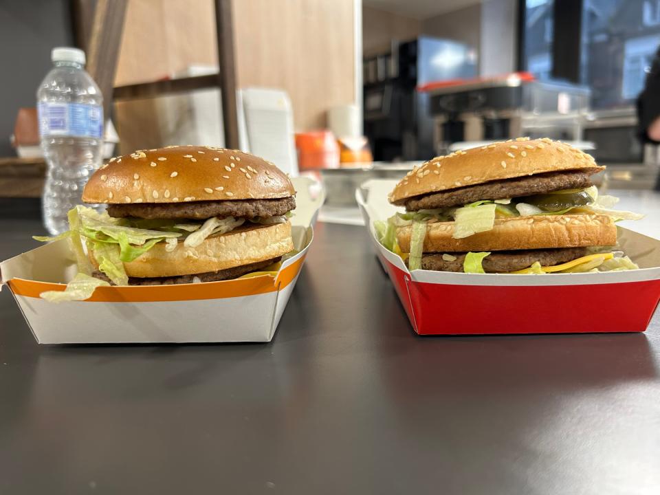 Two Big Mac burgers side by side in their boxes.