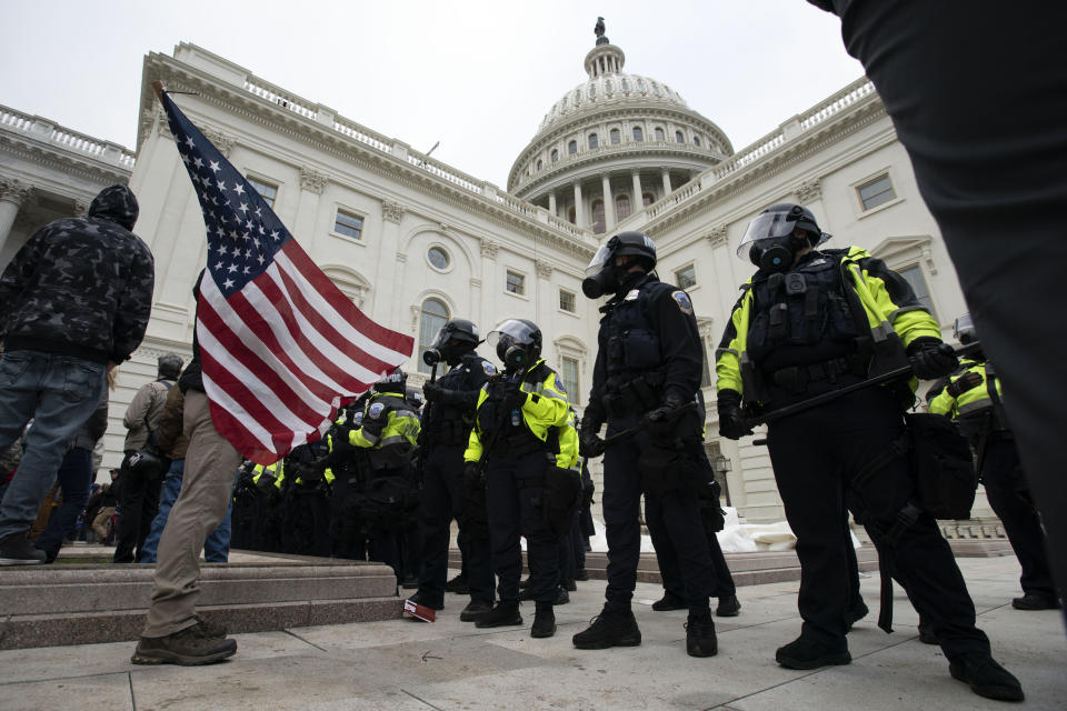 FILE - U.S. Capitol Police officers push back rioters who were trying to break into the U.S. Capitol on Jan. 6, 2021, in Washington. New internal documents provided by former Facebook employee-turned-whistleblower Frances Haugen provide a rare glimpse into how the company, after years under the microscope for the policing of its platform, appears to have simply stumbled into the Jan. 6 riot (AP Photo/Jose Luis Magana, File)