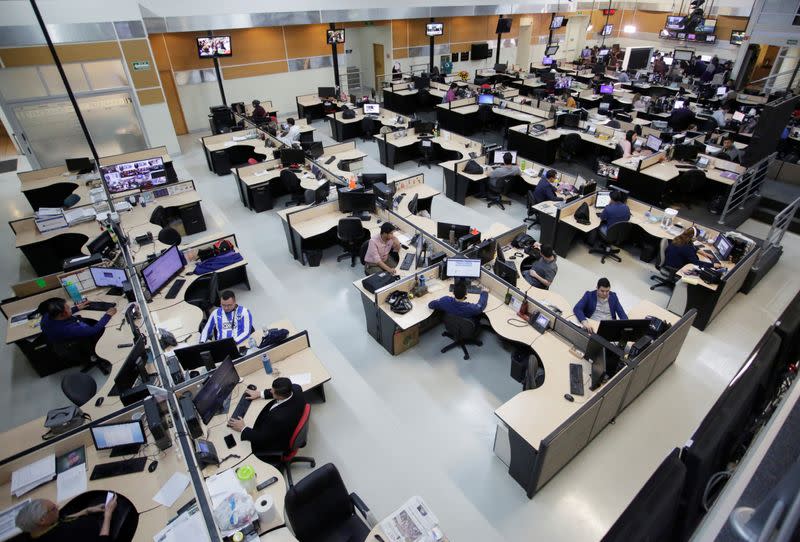 People work at the newsroom of Multimedios Television during "A Day Without Women" protest, as part of protests against gender violence, in Monterrey