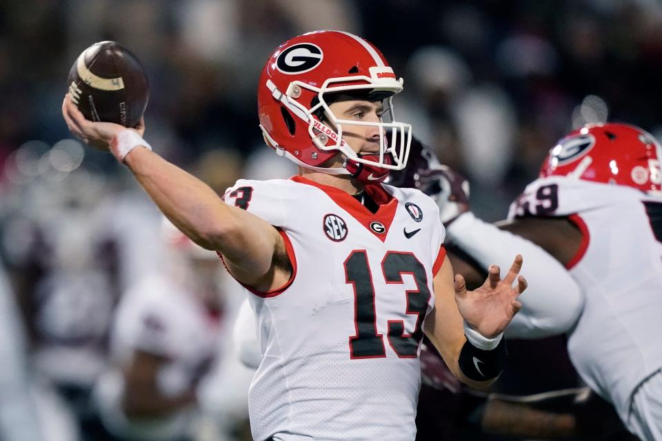 Georgia quarterback Stetson Bennett (13) looks to pass against Mississippi State during the first half of an NCAA college football game in Starkville, Miss., Saturday, Nov. 12, 2022. (AP Photo/Rogelio V. Solis)