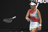 Jessica Pegula of the U.S. throws her racket in frustration during her quarterfinal against Ash Barty of Australia at the Australian Open tennis championships in Melbourne, Australia, Tuesday, Jan. 25, 2022. (AP Photo/Andy Brownbill)