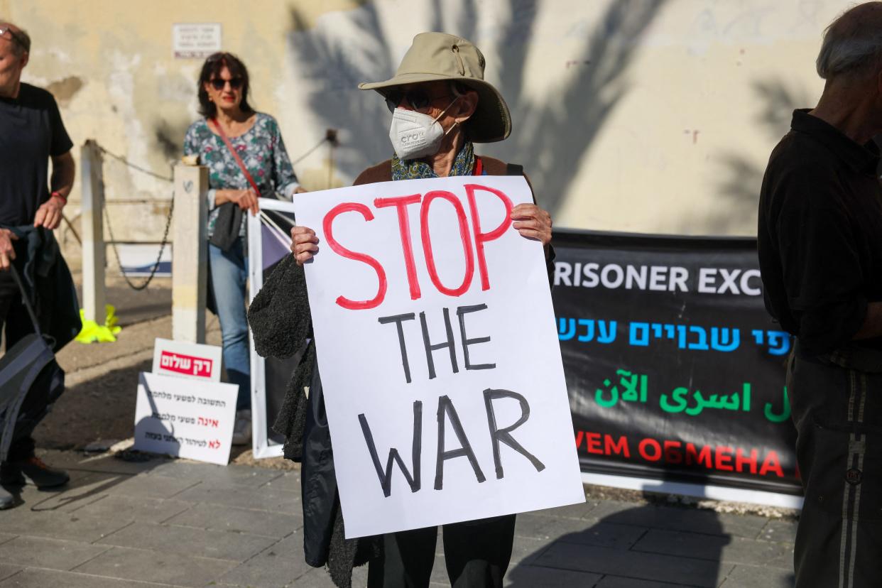 A woman holds an anti-war protest during a protest calling for a ceasefire and for the release of Israeli hostages held in Gaza since the October 7 attack by Palestinian militants, in the northern port city of Haifa on Jan. 20, 2024, amid ongoing battles between Israel and Hamas.