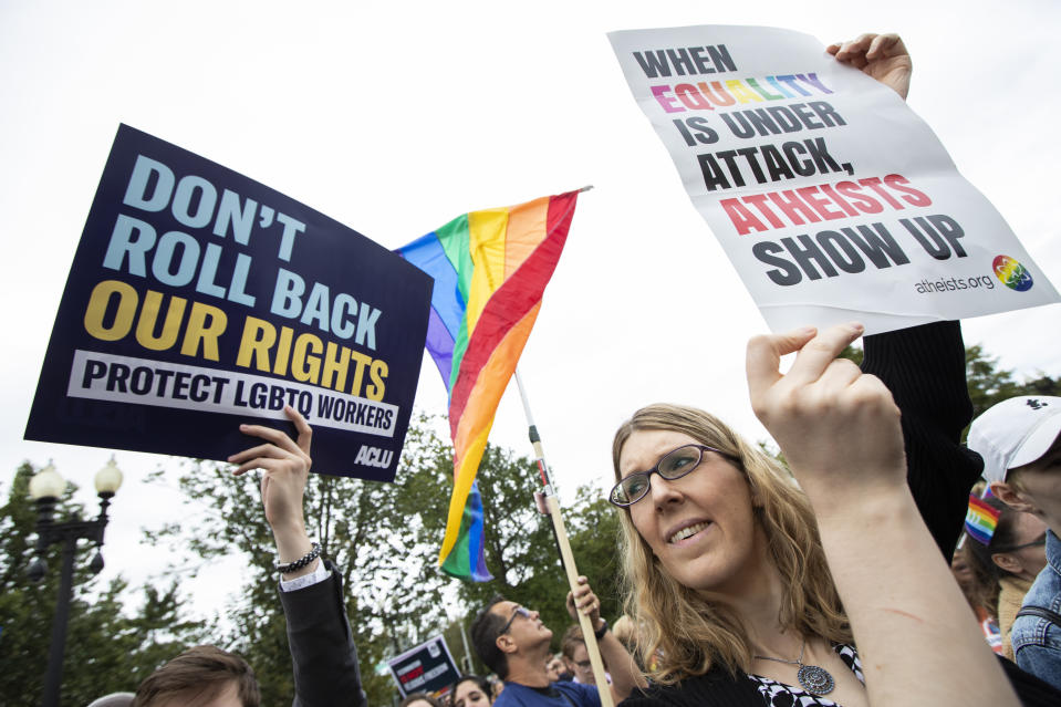 Transgender woman Alison Gill from Maryland, joins LGBT supporters in front of the U.S. Supreme Court, Tuesday, Oct. 8, 2019, in Washington. The Supreme Court is set to hear arguments in its first cases on LGBT rights since the retirement of Justice Anthony Kennedy. Kennedy was a voice for gay rights while his successor, Brett Kavanaugh, is regarded as more conservative. Amid their annual vigils for transgender homicide victims, trans-rights activists in the U.S. are trying to maintain long-term optimism even as many hard-won protections are under threat. (AP Photo/Manuel Balce Ceneta)