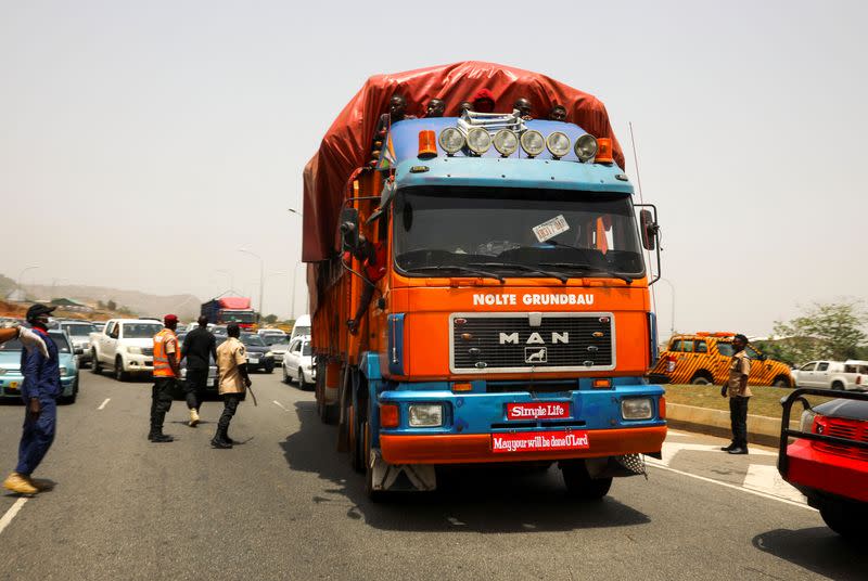 A truck transporting food is checked in Abuja