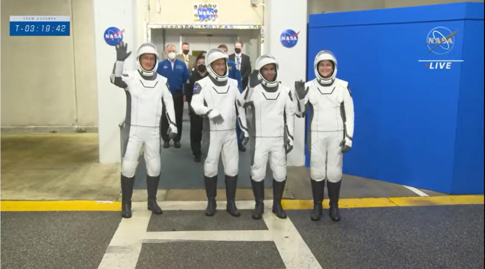 SpaceX's Crew-3 astronauts wave to family and friends as the walk out of NASA's Operations and Checkout Building at the Kennedy Space Center in Florida to head to the launch pad for their Nov. 10, 2021 launch to the International Space Station.