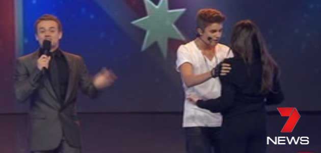 Over-zealous fan hops on stage to greet Justin Bieber during AGT performance. Photo: 7News